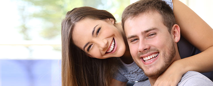 a young couple smiling